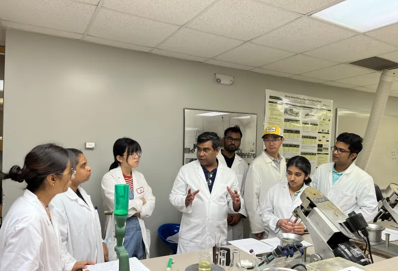 Dr. Shahidul Islam explaining the bread making during a class lab demonstration