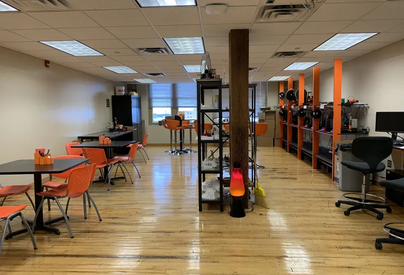 LAAVA classroom with tables, chairs, computers and other equipment.