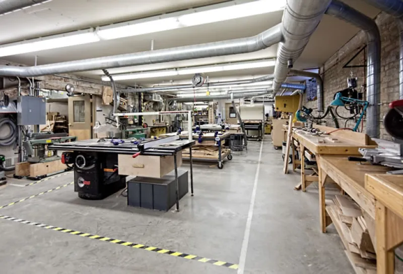 Woodshop with tables and equipment.