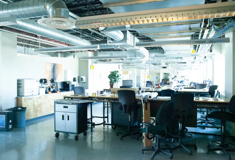 Open studio space with desks, chairs and computers in Klai Hall.