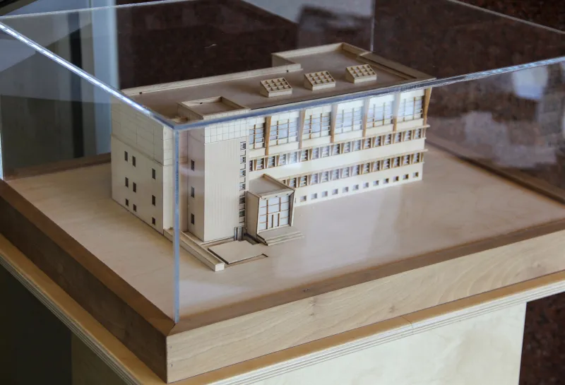 Wooden model of Klai Hall protected by glass cover.