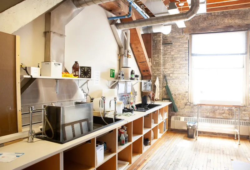 Photography studio with equipment and bench working area.