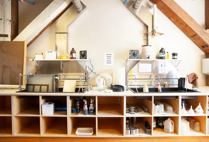 Photography studio with equipment and bench working area.