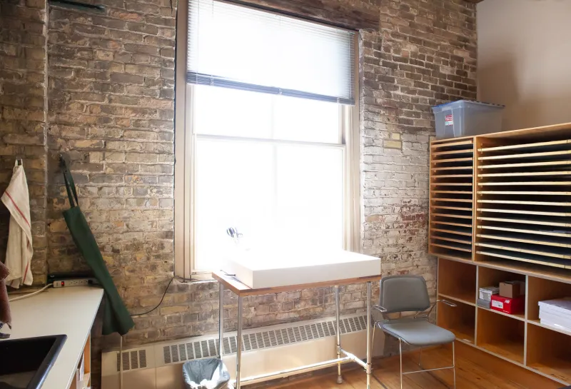 Photography studio with equipment and working area.