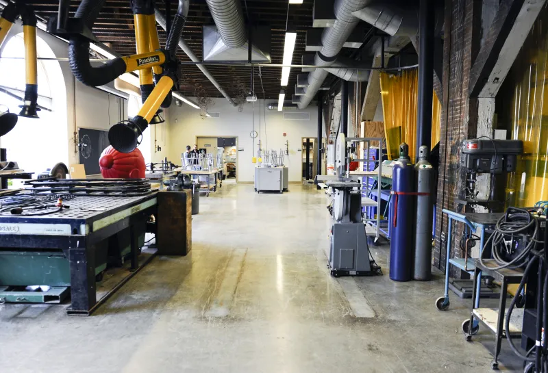 Sculpture studio with tables and euipment.
