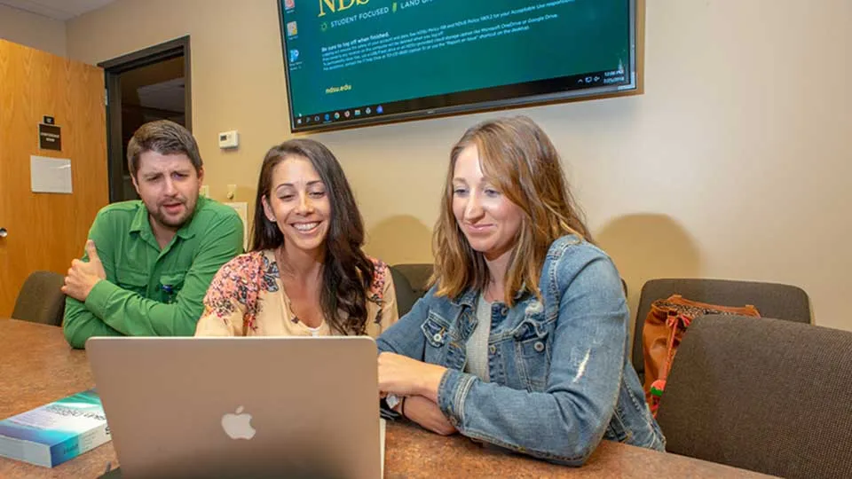 ndsu nursing students looking at a computer