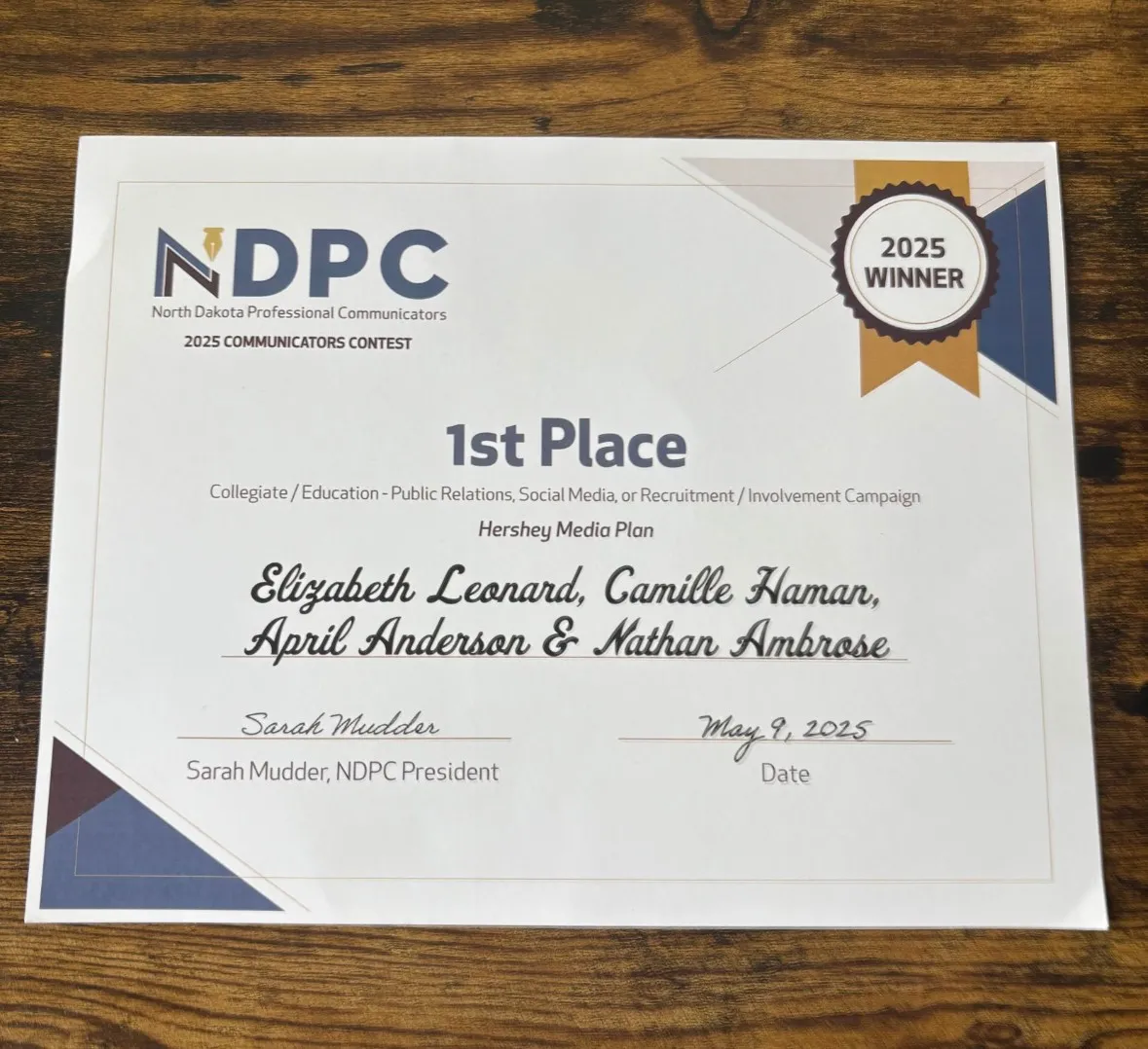 The first place certificate with the names of NDSU strategic communication students Elizabeth Leonard, Camille Haman, April Anderson and Nathan Ambrose