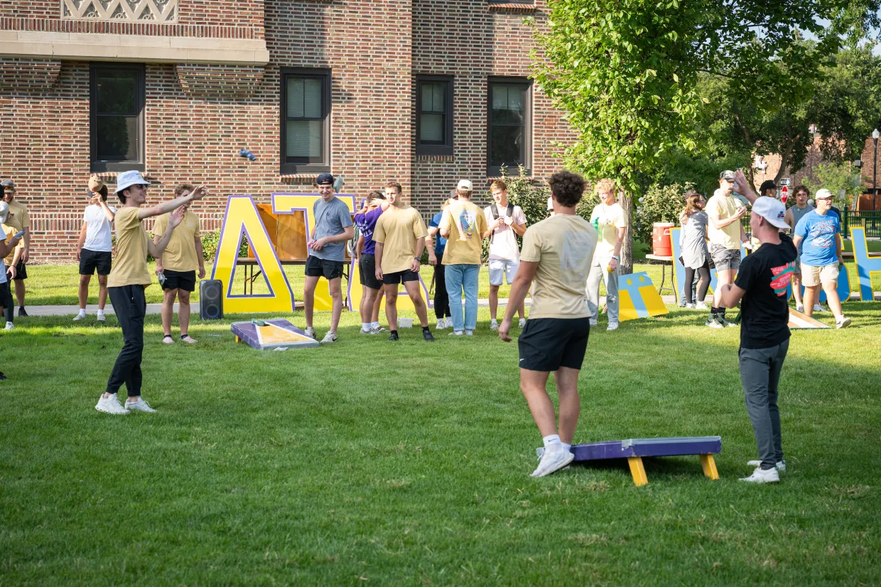 students playing cornhole during a Welcome Week event