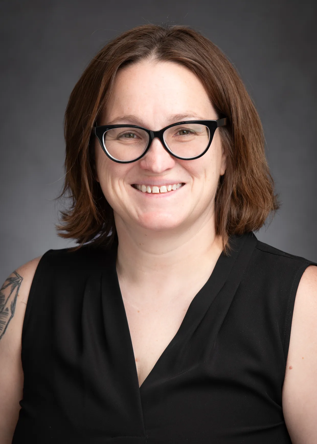 Erin Gillam smiling confidently at the camera.