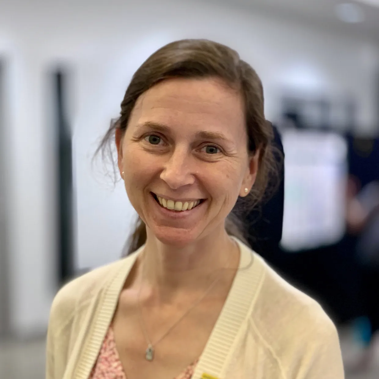 Jennifer smiling confidently at camera.