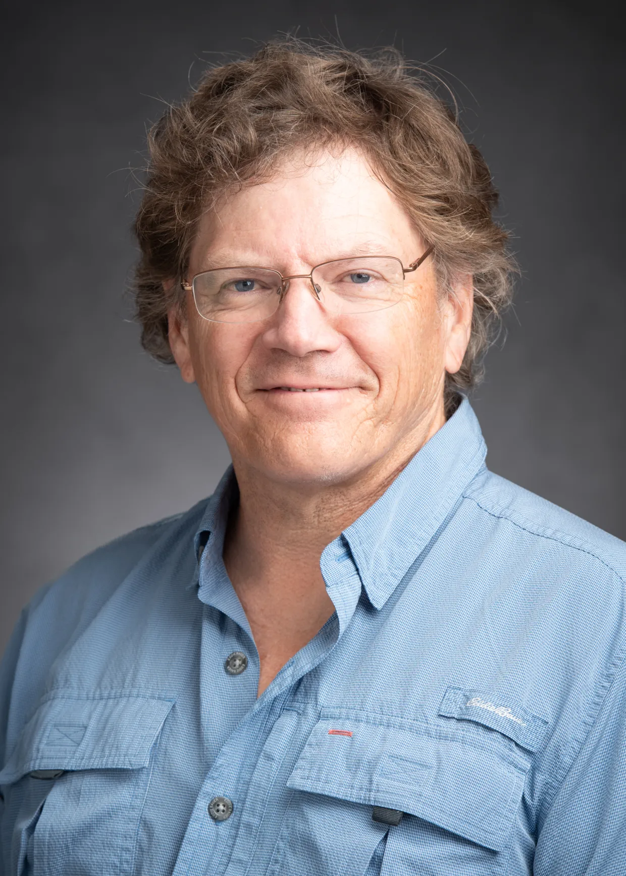 Steve Travers smiling confidently.