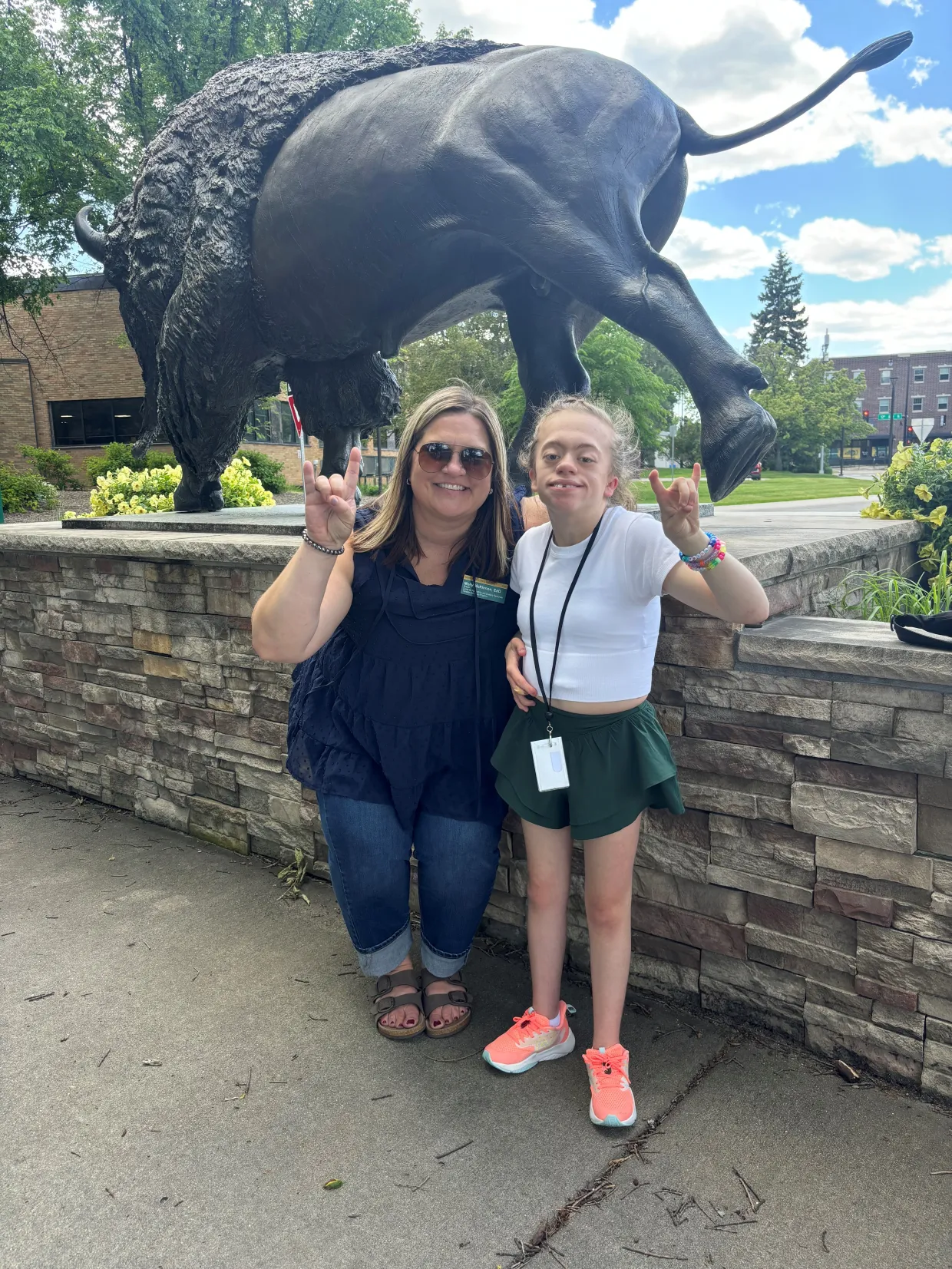 student and staff showing bison pride