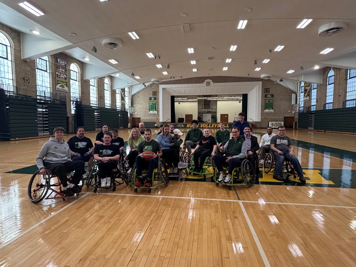 President cook and the NDSU Bison Unified wheelchair basketball.