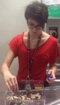 Chelsea Rodriguez sorting mealworm beetles.