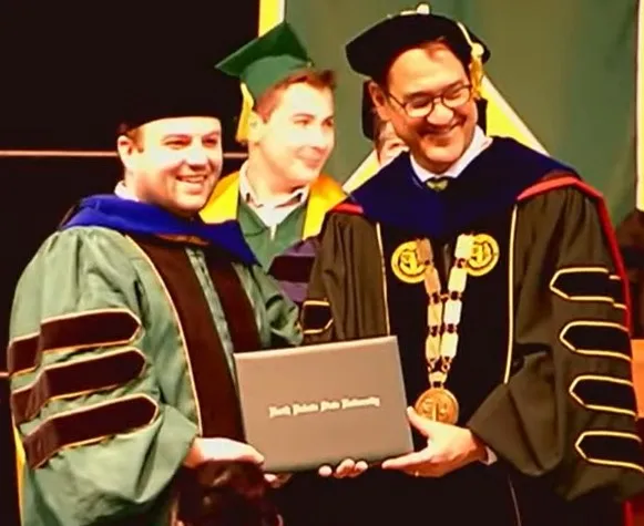 Jacob receiving his PhD.