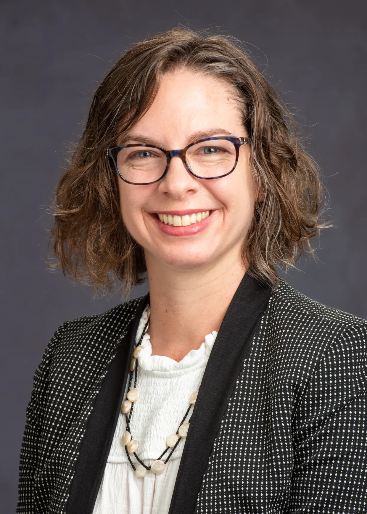 Julia Bowsher smiling confidently