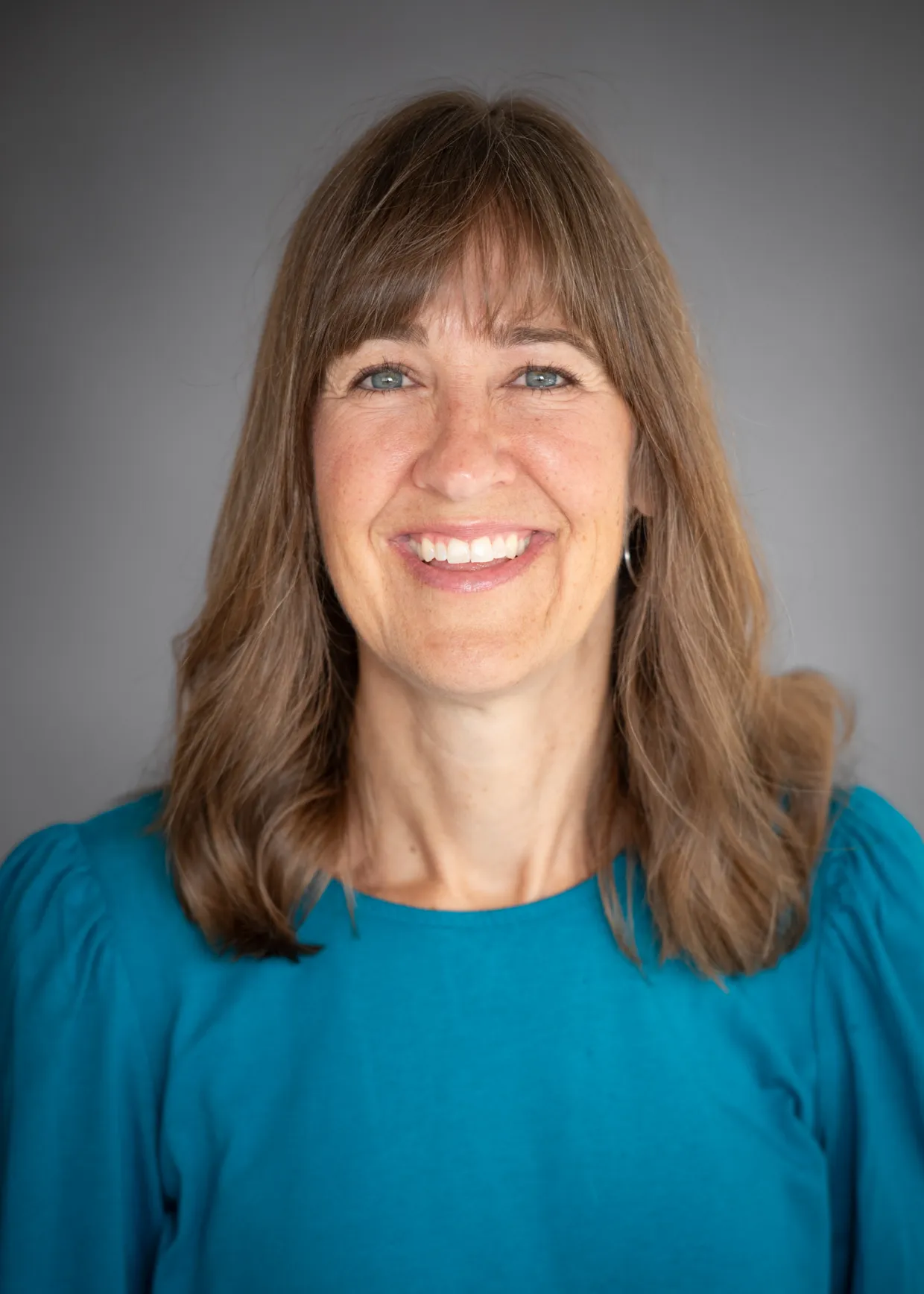 Britt Heidinger smiling confidently at camera. 