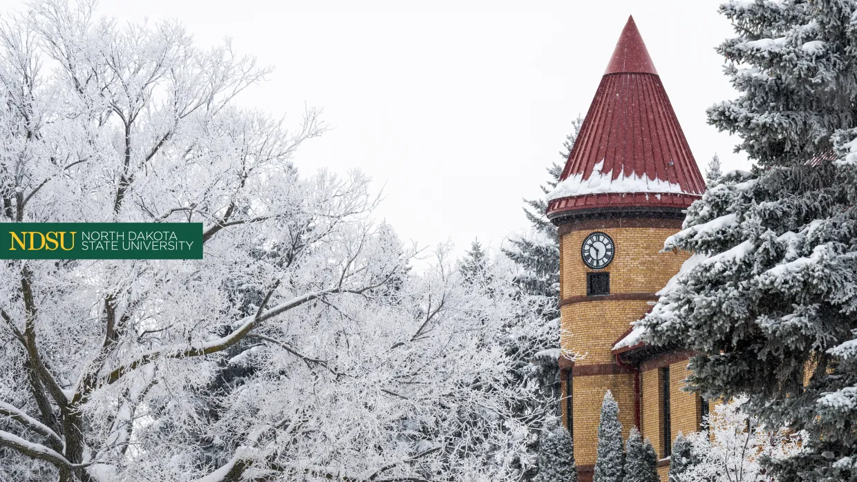 close up of Old Main clock on winter day