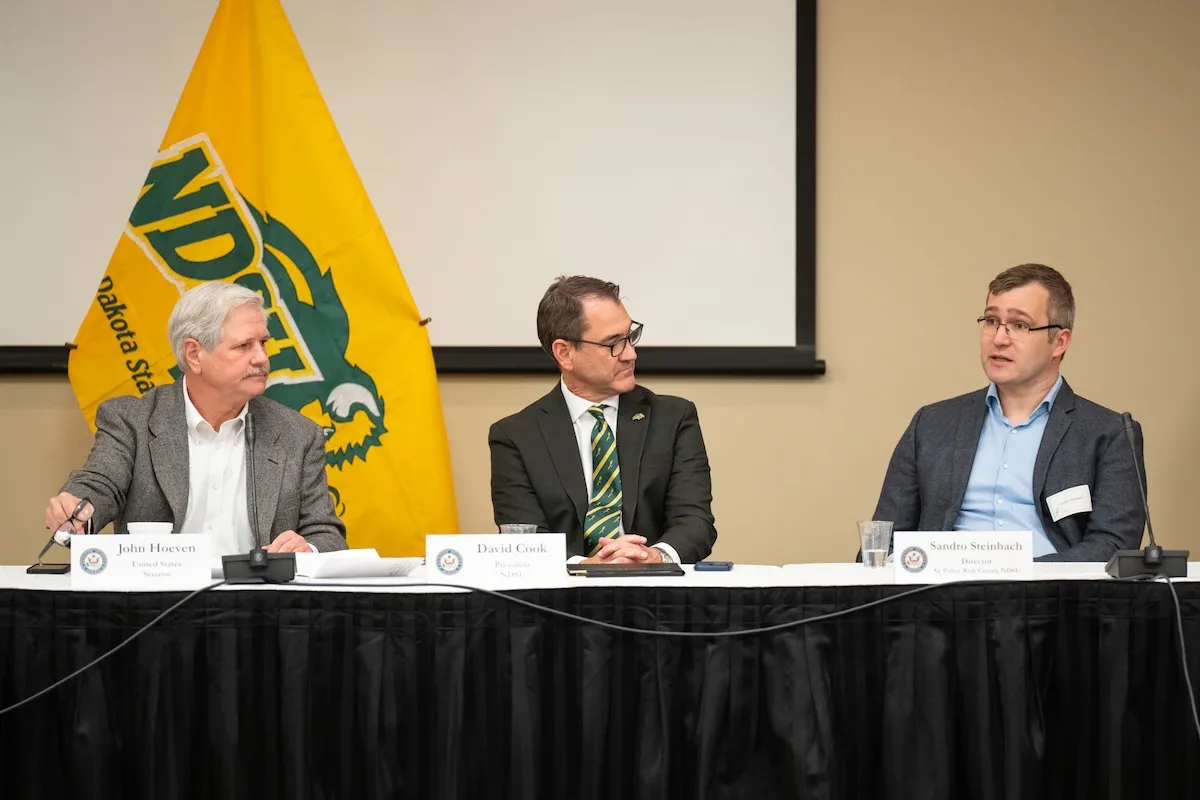 U.S. Sen. John Hoeven, NDSU President David Cook and Sandro Steinbach, director of the NDSU Ag Risk Policy Center.