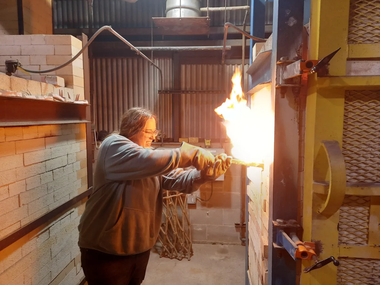 NDSU student using the new kiln at NDSU.