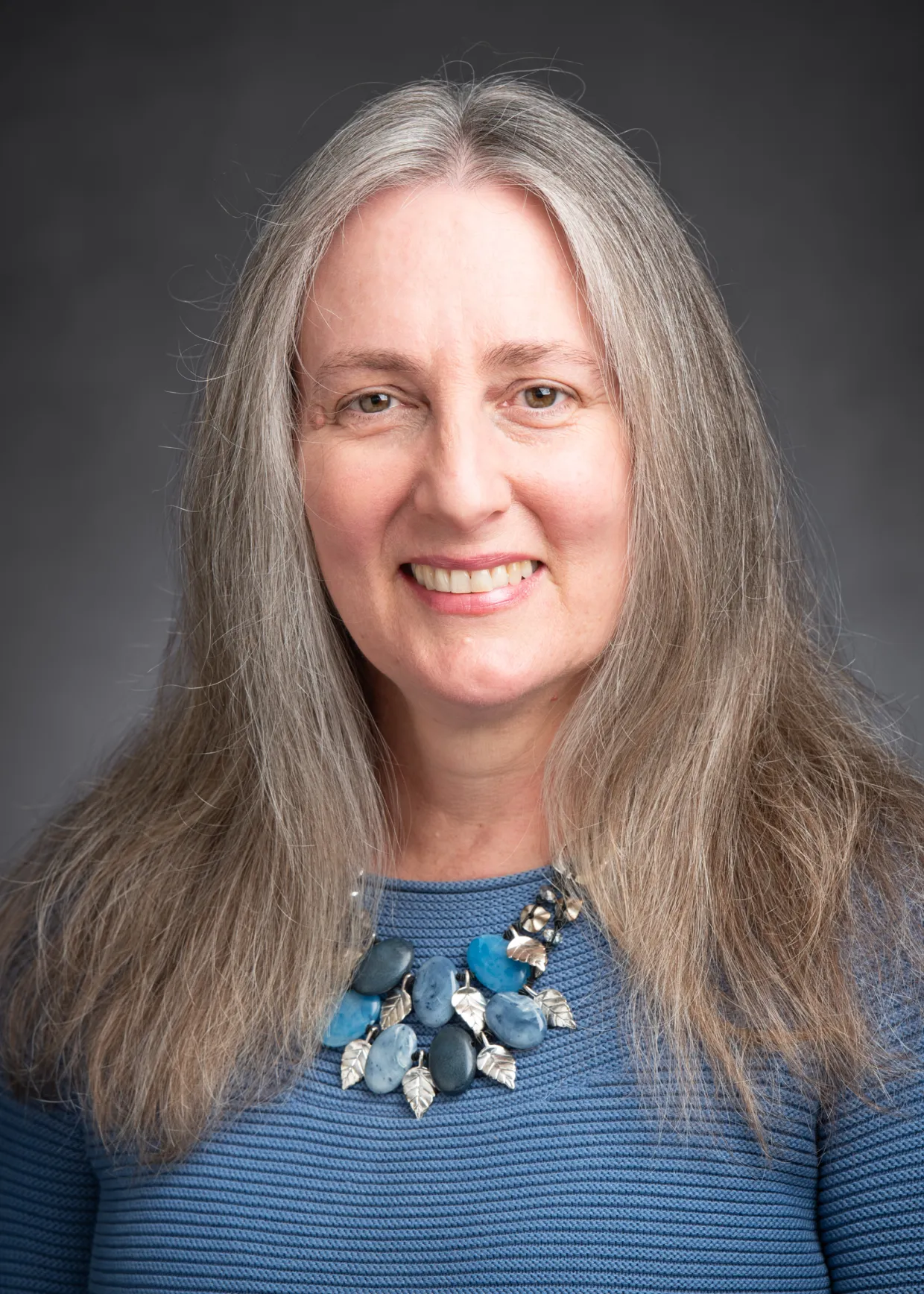 Laura Aldrich-Wolfe smiling confidently at camera.