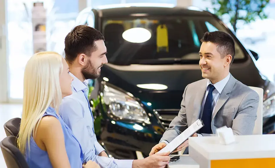 Sales professional discussing a automobile deal