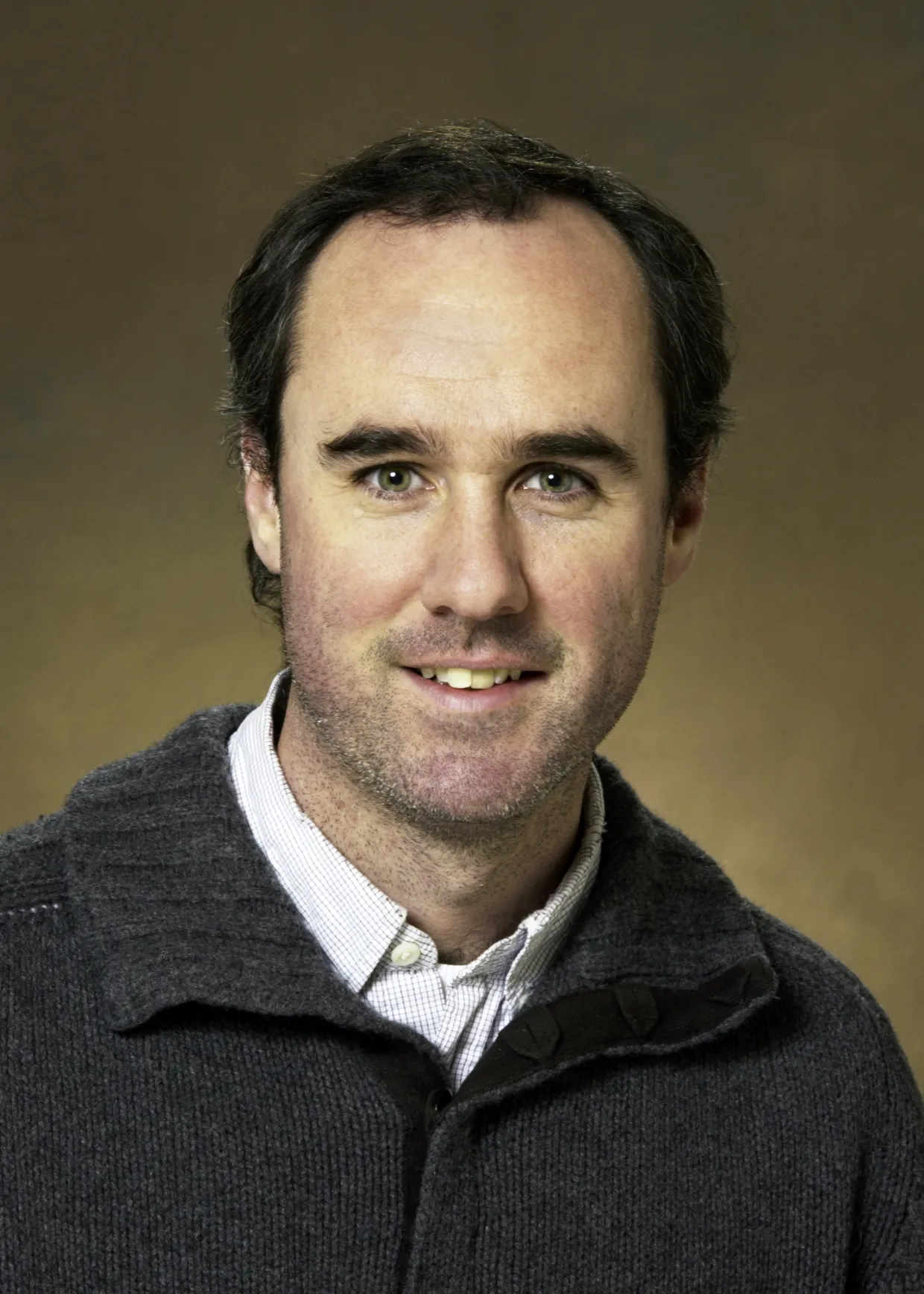 Timothy Greives smiling confidently at camera.