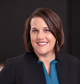 Stefnee Trzpuc smiling confidently at camera.