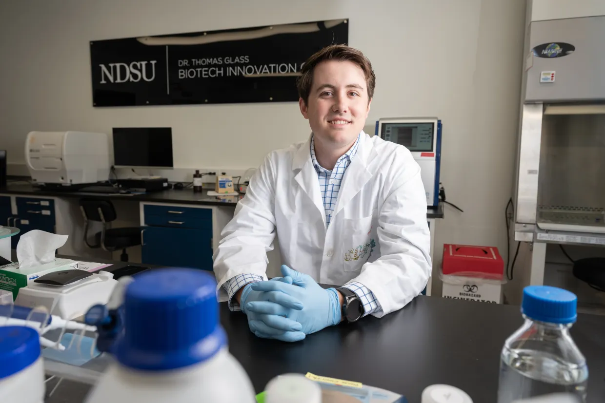 NDSU alum Wyatt Warkenthien in a lab