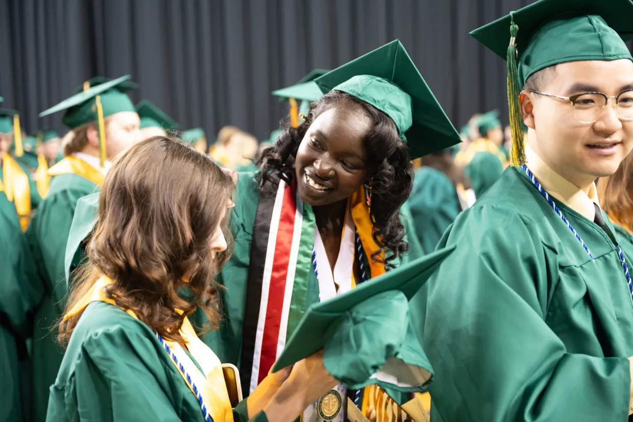 students getting ready for their commencement ceremony