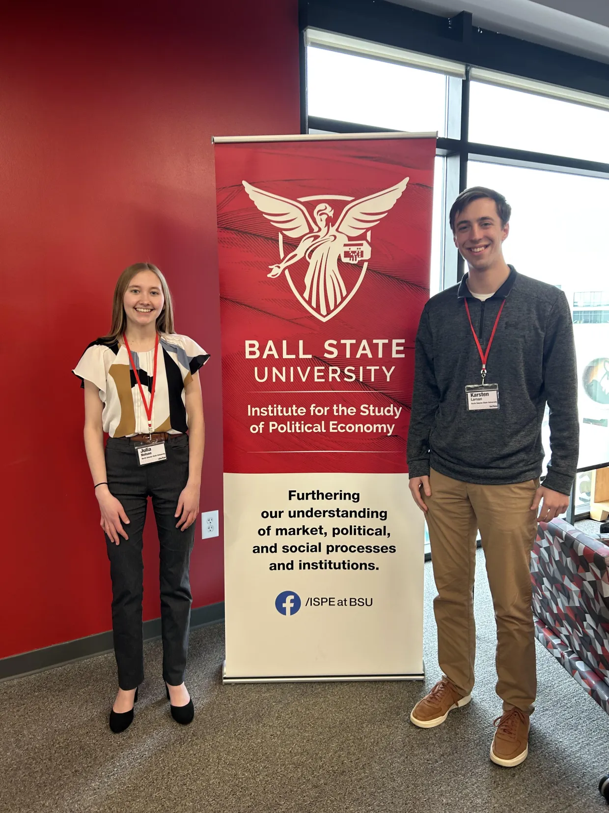 Two undergrads at a conference at Ball State University sponsored by the Challey Institute