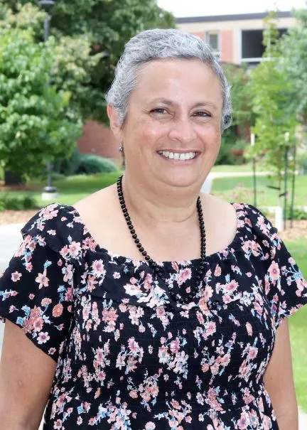 Dr. Berti smiling confidently at camera.