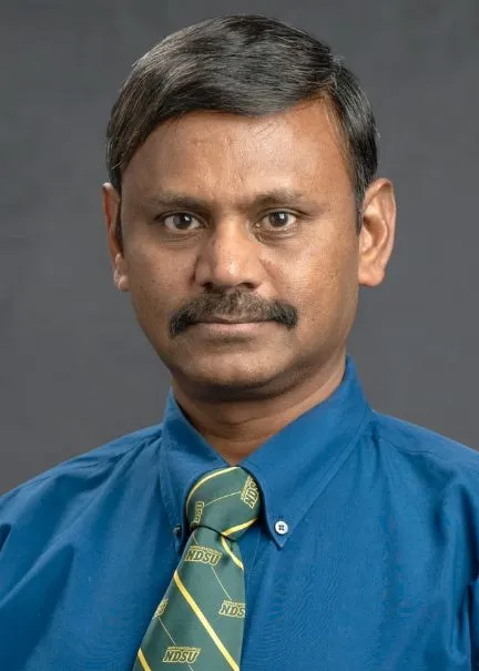 Cannayen looking confidently at camera.