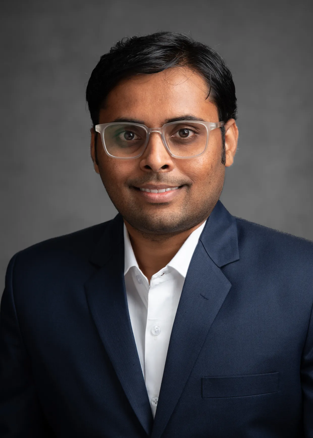 Prasad smiling confidently at camera.