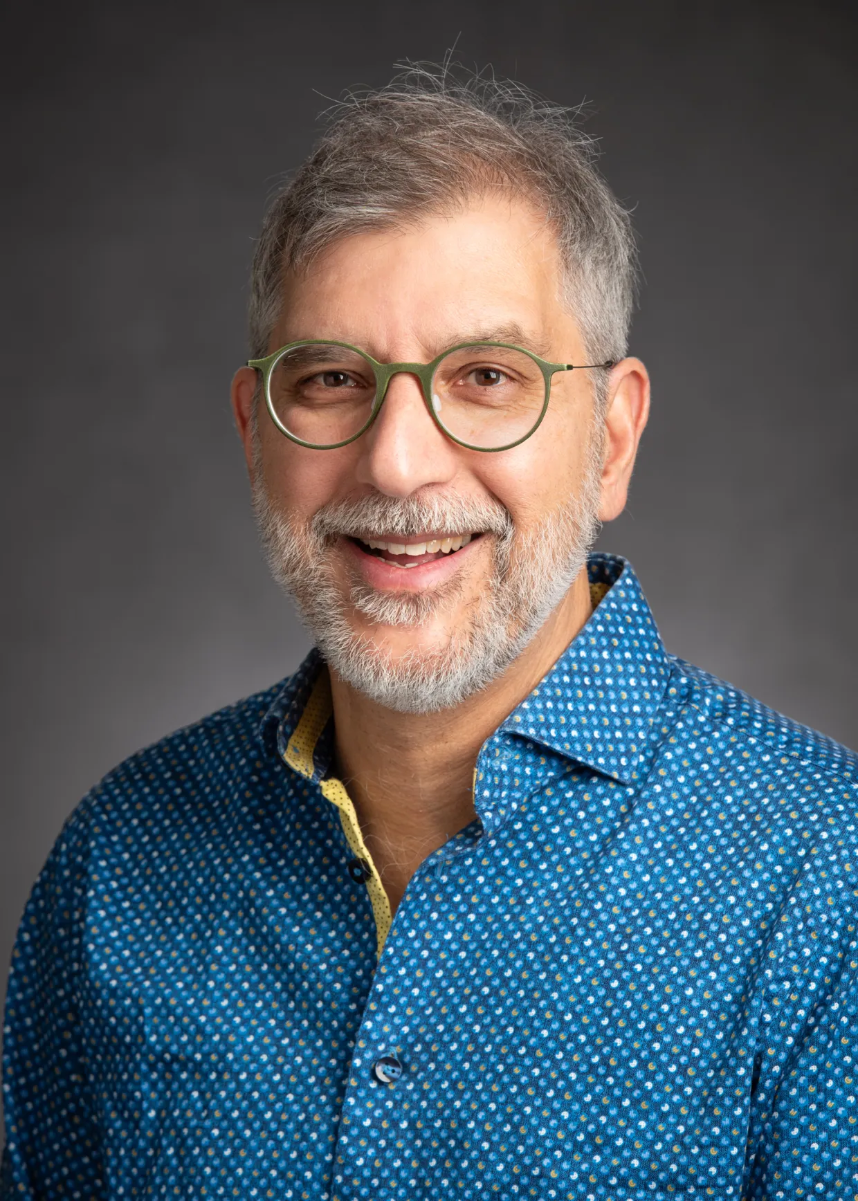 Dr. Bernhardt Saini-Eidukat smiling confidently at camera.