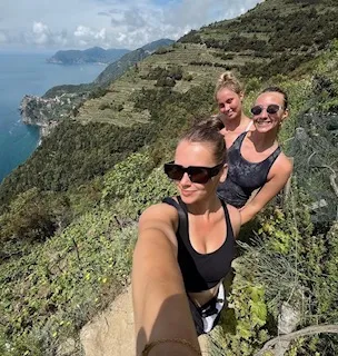 Selfie of three students hiking