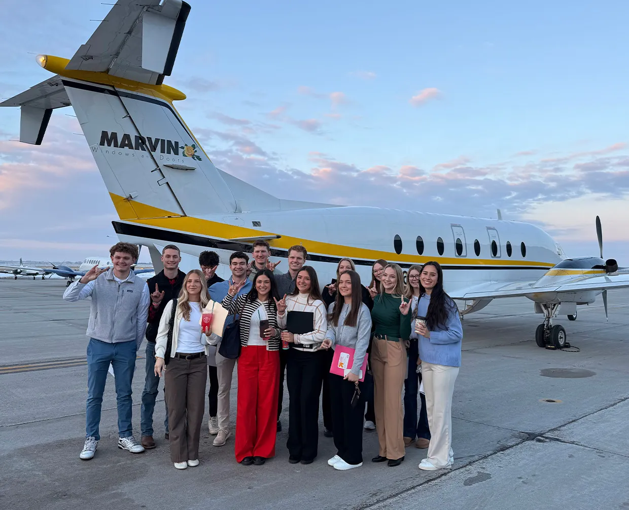 Sales Club in front of the Marvin Plane