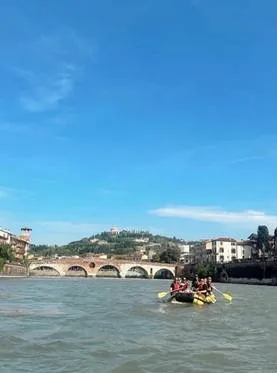 Group of students rafting in Verona, Italy on a sunny day