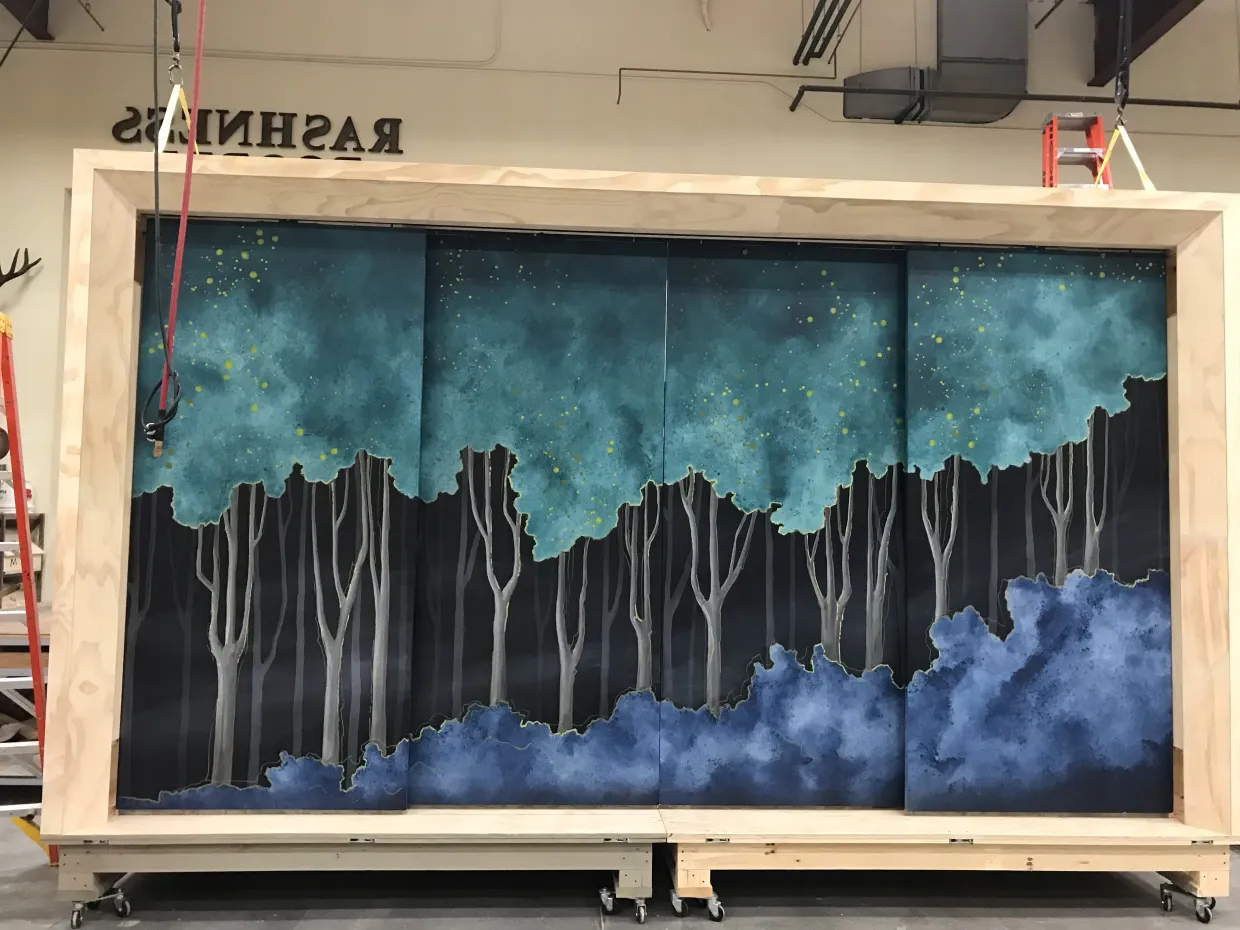 A background of trees for a theatre production painted by NDSU faculty member Tiffany Fier.