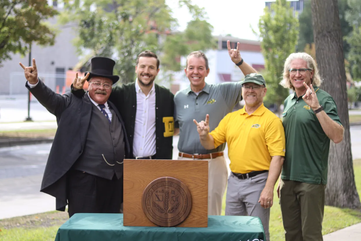 President Teddy Roosevelt, Robbie Lauf, NDSU President Marshall Stewart, Thomas Claeys, and Todd West.
