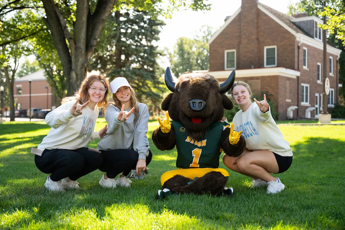 Students have their horns up with Thundar at Homecoming Kickoff.
