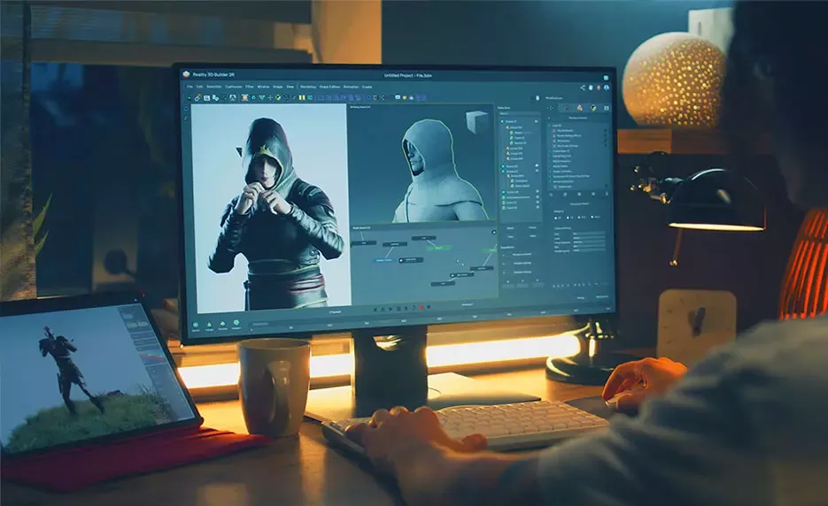 Computer Monitor with Game developer software and person typing