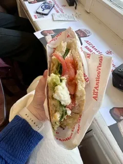 Italian food item wrapped in paper
