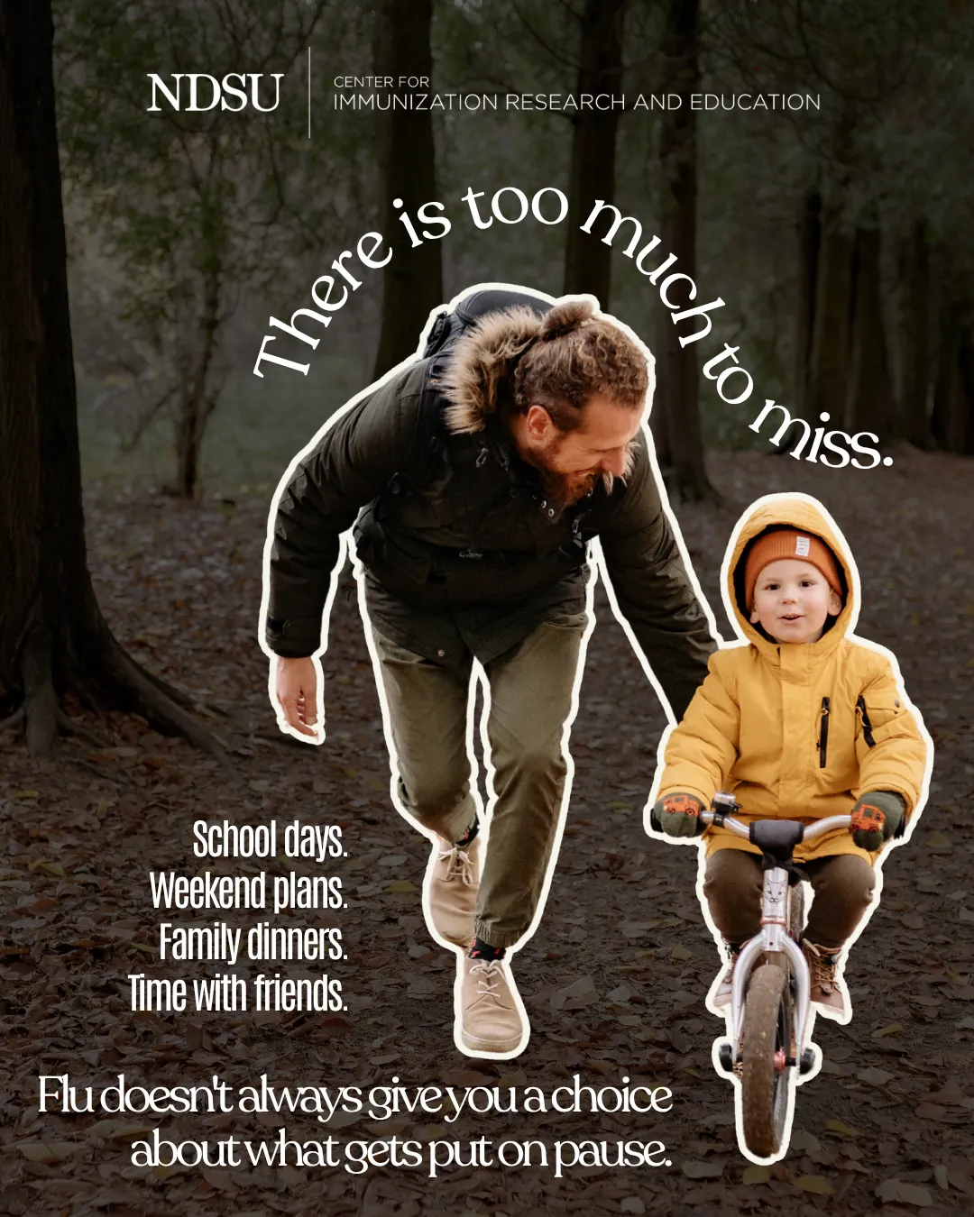 A father pushes a child riding a bike on a wooded path.