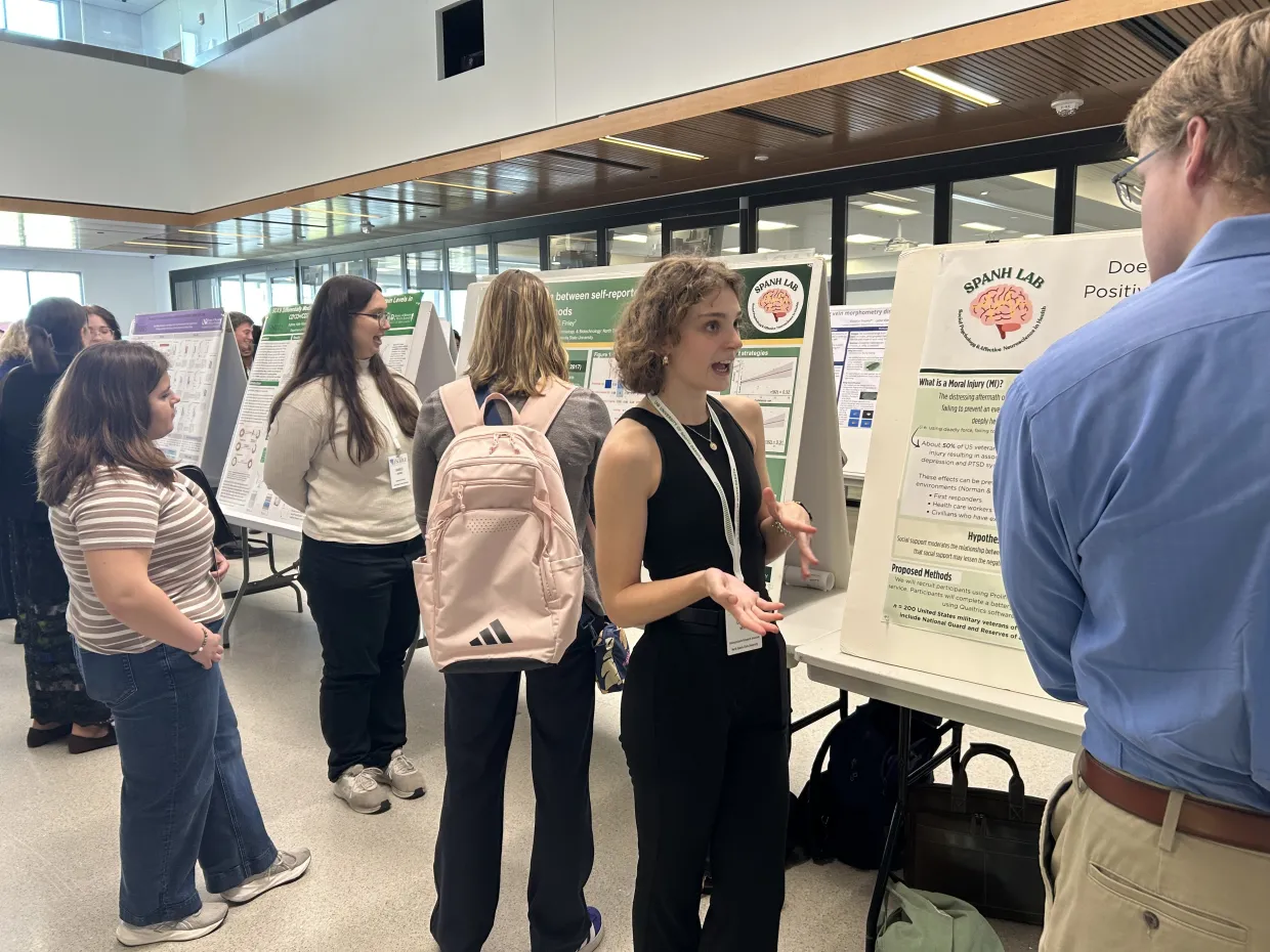 SPANH lab members Isabelle Galindo and Cherish Morin present their research at ND INBRE 2026