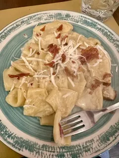 pasta with toppings on a plate