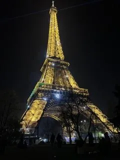 Eiffel tower at night with all its lights on