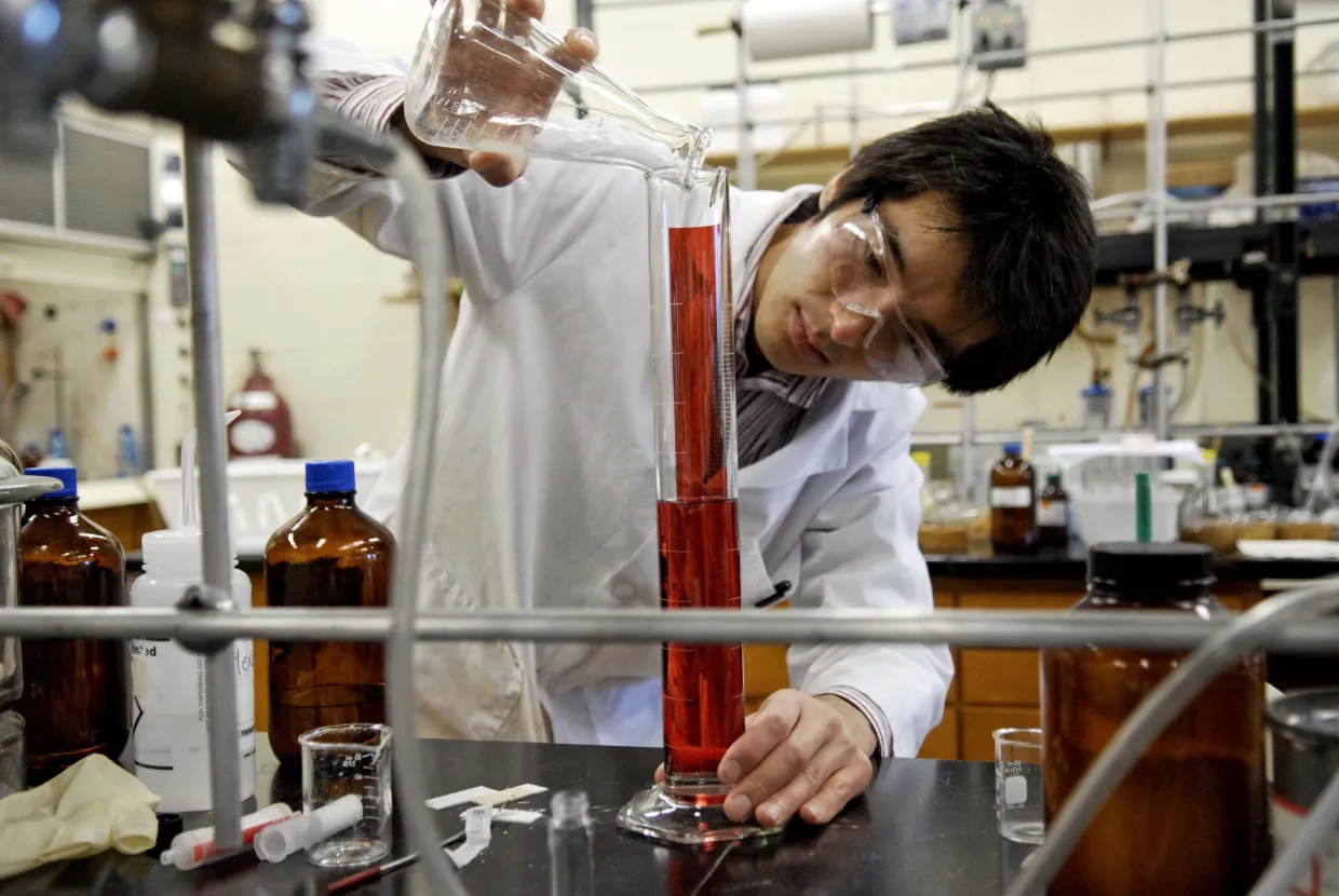 Student performing an experiment in lab
