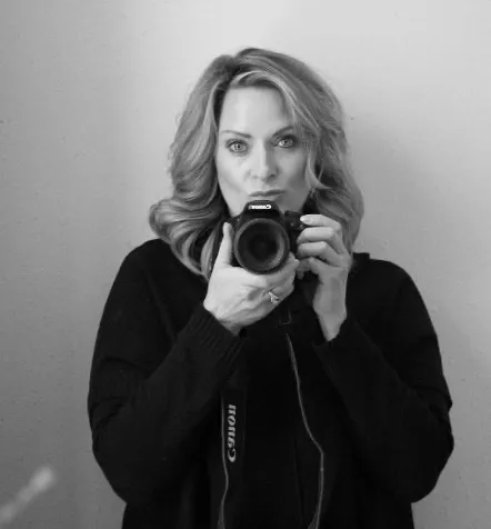 Sparrow holding camera while confidently looking at camera.