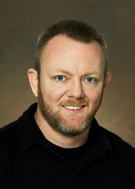 Ned Dochtermann smiling confidently.